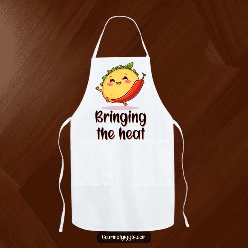 Funny apron with a smiling taco kicking a dancing chili pepper, perfect for humorous and fiesta-themed kitchen wear.